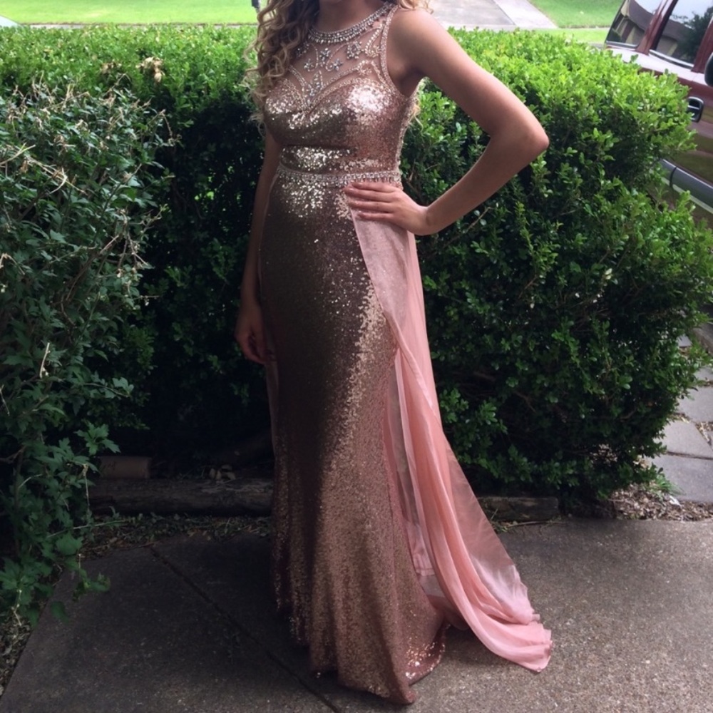 Stunning fully sequined gown in rose gold with sheer sweeping train.